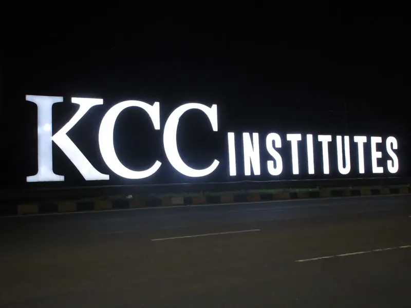 KCC Institutes — The letters lit up after dark — site photo